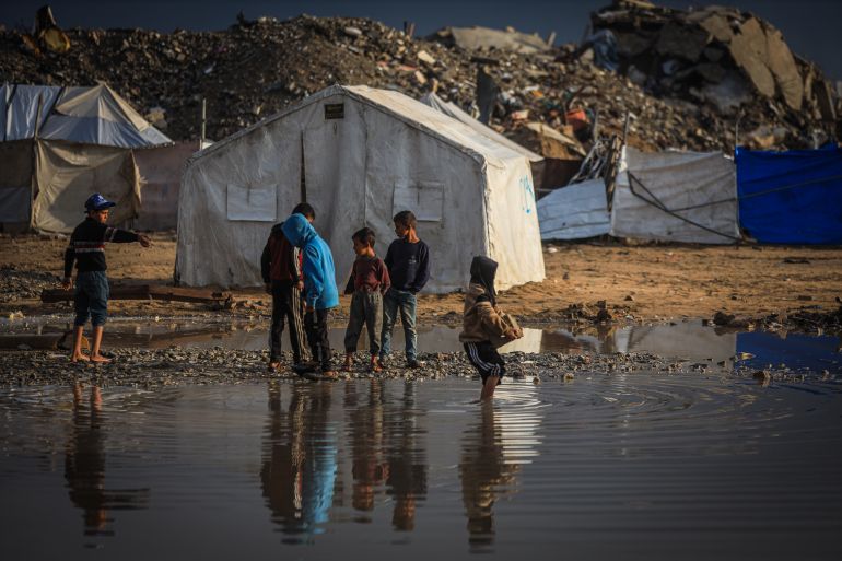 15gaza-1765358914 GAZA CITY, GAZA - DECEMBER 11: Palestinians struggle with flooding after heavy rain hits the Abu Marhil Camp in the Az-Zaytun neighborhood in Gaza City, Gaza on December 11, 2025. Conditions for displaced residents whose homes were destroyed in Israeli attacks, worsening as they continue to struggle not only with the devastation of the conflict but also with the deteriorating weather conditions. ( Hamza Z. H. Qraiqea - Anadolu Agency )