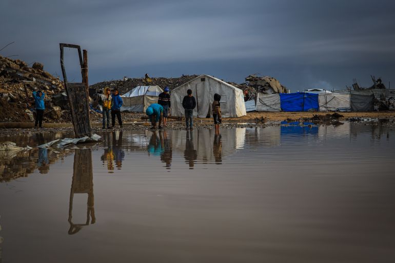 17gaza-1765358939 GAZA CITY, GAZA - DECEMBER 11: Palestinians struggle with flooding after heavy rain hits the Abu Marhil Camp in the Az-Zaytun neighborhood in Gaza City, Gaza on December 11, 2025. Conditions for displaced residents whose homes were destroyed in Israeli attacks, worsening as they continue to struggle not only with the devastation of the conflict but also with the deteriorating weather conditions. ( Hamza Z. H. Qraiqea - Anadolu Agency )