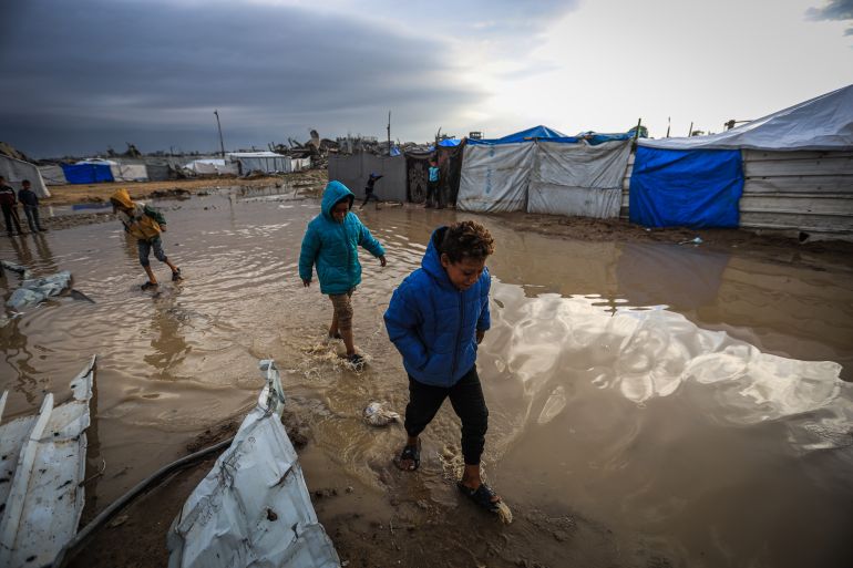 18gaza-1765358954 GAZA CITY, GAZA - DECEMBER 11: Palestinians struggle with flooding after heavy rain hits the Abu Marhil Camp in the Az-Zaytun neighborhood in Gaza City, Gaza on December 11, 2025. Conditions for displaced residents whose homes were destroyed in Israeli attacks, worsening as they continue to struggle not only with the devastation of the conflict but also with the deteriorating weather conditions. ( Hamza Z. H. Qraiqea - Anadolu Agency )