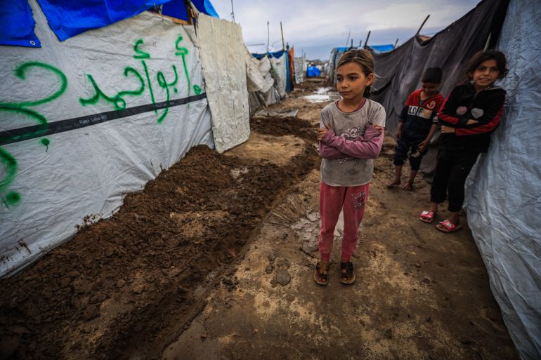 23gaza-1765359043 GAZA CITY, GAZA - DECEMBER 11: Palestinians struggle with flooding after heavy rain hits the Abu Marhil Camp in the Az-Zaytun neighborhood in Gaza City, Gaza on December 11, 2025. Conditions for displaced residents whose homes were destroyed in Israeli attacks, worsening as they continue to struggle not only with the devastation of the conflict but also with the deteriorating weather conditions. ( Hamza Z. H. Qraiqea - Anadolu Agency )