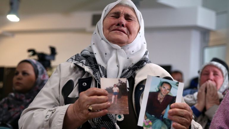 A woman reacts after the verdict on former Bosnian Serb political leader Radovan Karadzic's appeal of his 40 year sentence for war crimes, in the Memorial centre Potocari near Srebrenica, Bosnia and Herzegovina March 20, 2019. REUTERS/Dado Ruvic