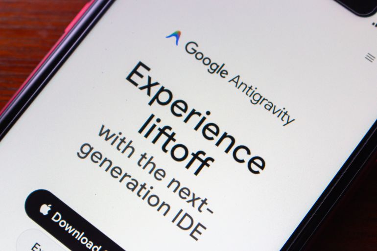 Quito, ECUADOR - Nov 25 2025 : Close-up of a smartphone displaying Google Antigravity website, promoting a next-generation integrated development environment for developers.