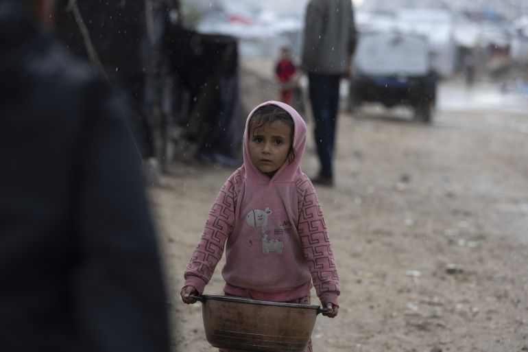 39-3-1765872215 GAZA CITY, GAZA - DECEMBER 15: Palestinians displaced by Israeli attacks struggle to carry out their daily lives under harsh conditions in makeshift tents in Gaza City, Gaza on December 15, 2025. Heavy rainfall and strong storms affect the Gaza Port area in western Gaza City, damaging tents where displaced Palestinians take shelter. Adverse weather conditions further exacerbate the hardships faced by displaced Palestinians living under severe humanitarian conditions. ( Mahmoud Abu Hamda - Anadolu Agency )