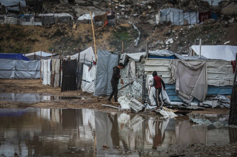 3gaza-1765358727 GAZA CITY, GAZA - DECEMBER 11: Palestinians struggle with flooding after heavy rain hits the Abu Marhil Camp in the Az-Zaytun neighborhood in Gaza City, Gaza on December 11, 2025. Conditions for displaced residents whose homes were destroyed in Israeli attacks, worsening as they continue to struggle not only with the devastation of the conflict but also with the deteriorating weather conditions. ( Hamza Z. H. Qraiqea - Anadolu Agency )