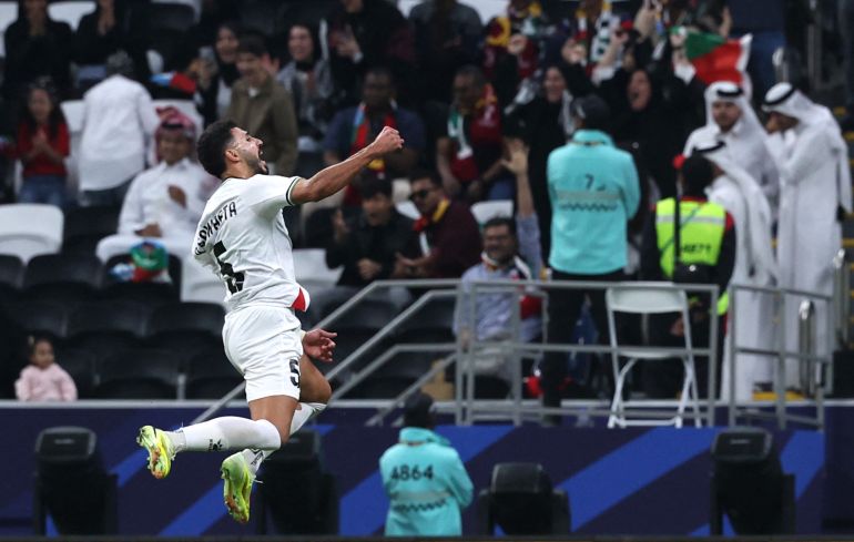 54-12-1764666633 Soccer Football - FIFA Arab Cup - Qatar 2025 - Group A - Qatar v Palestine - Al Bayt Stadium, Al Khor, Qatar - December 1, 2025 Palestine's Ameed Sawafta celebrates their first goal, an own goal scored by Qatar's Sultan Al Brake REUTERS/Thaier Al-Sudani