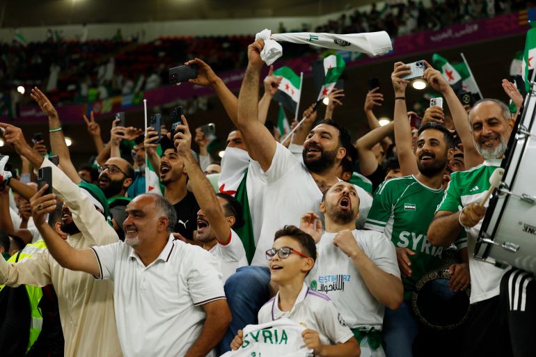 54-7-1764666470 Soccer Football - FIFA Arab Cup - Qatar 2025 - Group A - Tunisia v Syria - Ahmad bin Ali Stadium, Al Rayyan, Qatar - December 1, 2025 Syria fans celebrate after the match REUTERS/Ibraheem Abu Mustafa