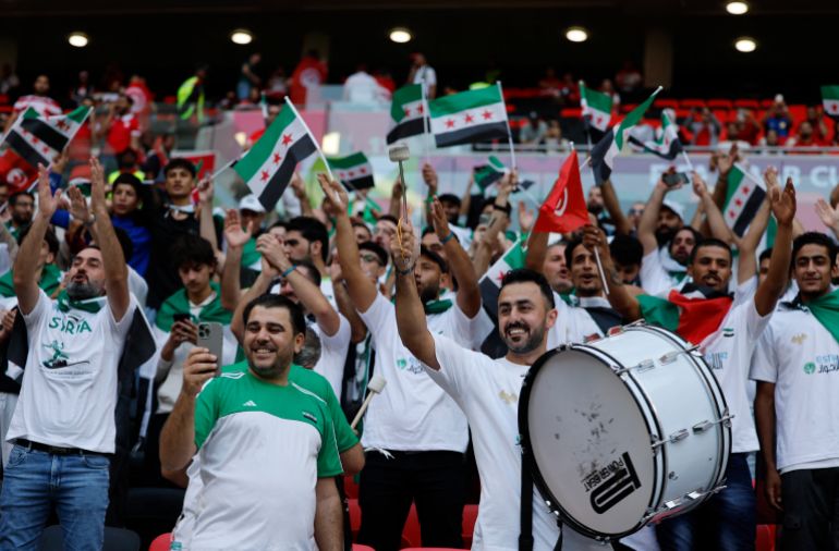 54-9-1764666492 Soccer Football - FIFA Arab Cup - Qatar 2025 - Group A - Tunisia v Syria - Ahmad bin Ali Stadium, Al Rayyan, Qatar - December 1, 2025 Syria fans before the match REUTERS/Ibraheem Abu Mustafa