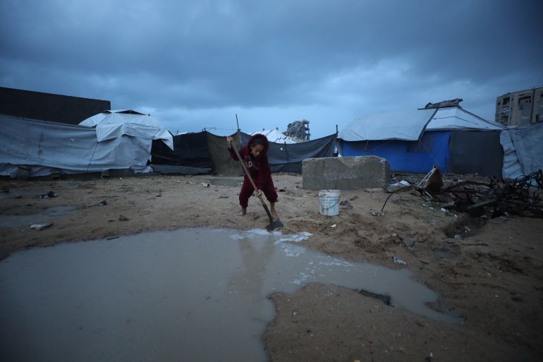 87-12-1765870130 GAZA CITY, GAZA - DECEMBER 15: Palestinians, displaced by Israeli attacks, struggle to survive in makeshift tents in Gaza City, Gaza on December 15, 2025. As severe storms and heavy rainfall hit the city, many makeshift tents were damaged, forcing some families to seek refuge beneath the collapsed roofs of destroyed homes and mosques. ( Khames Alrefi - Anadolu Agency )