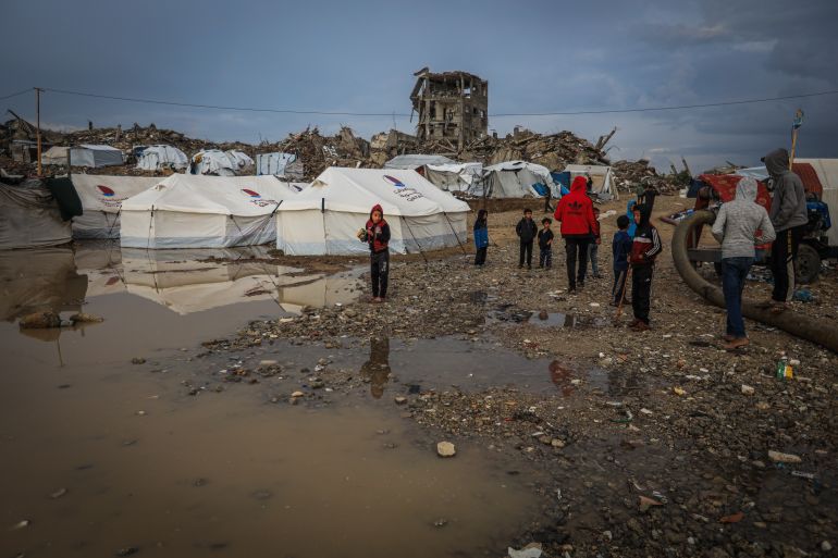 9gaza-1765358817 GAZA CITY, GAZA - DECEMBER 11: Palestinians struggle with flooding after heavy rain hits the Abu Marhil Camp in the Az-Zaytun neighborhood in Gaza City, Gaza on December 11, 2025. Conditions for displaced residents whose homes were destroyed in Israeli attacks, worsening as they continue to struggle not only with the devastation of the conflict but also with the deteriorating weather conditions. ( Hamza Z. H. Qraiqea - Anadolu Agency )