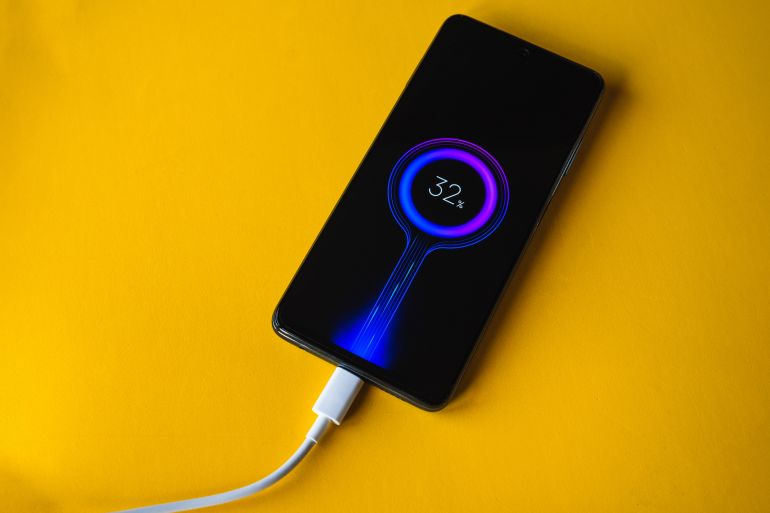 Lleida, Spain. 11.25.2020: Xiaomi POCO X3 new blue smartphone charging battery, developed by Xiaomi Inc. Xiaomi is a privately owned Chinese electronics company.; Shutterstock ID 1902883165; purchase_order: k; job: ; client: ; other: