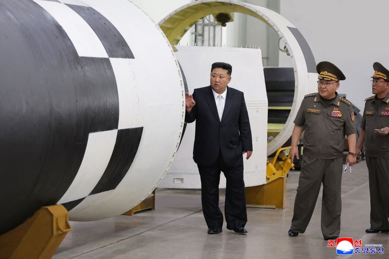 This picture taken on September 1, 2025 and released from North Korea's official Korean Central News Agency (KCNA) via KNS on September 2, 2025 shows North Korea's leader Kim Jong Un (L) visiting the research institute of the Institute of Chemical Materials under the General Missile Administration at an undisclosed location in North Korea. (Photo by KCNA VIA KNS / AFP) / SOUTH KOREA OUT / REPUBLIC OF KOREA OUT ---EDITORS NOTE--- RESTRICTED TO EDITORIAL USE - MANDATORY CREDIT "AFP PHOTO/KCNA VIA KNS" - NO MARKETING NO ADVERTISING CAMPAIGNS - DISTRIBUTED AS A SERVICE TO CLIENTS / THIS PICTURE WAS MADE AVAILABLE BY A THIRD PARTY. AFP CAN NOT INDEPENDENTLY VERIFY THE AUTHENTICITY, LOCATION, DATE AND CONTENT OF THIS IMAGE ---