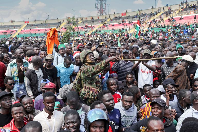 Kenyan Military Officer attempts to control crowds as supporters and mourners surged forward to get a glimpse of Kenya’s opposition leader and former Prime Minister Raila Odinga's body which lay in state for public viewing during his State Funeral in Nairobi on October 17, 2025.