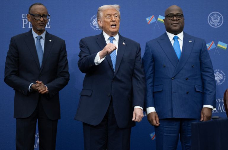 afp_6932612bec53-1764909356 US President Donald Trump (C) gestures as he hosts the signing ceremony of a peace deal with the President of Rwanda Paul Kagame (L) and the President of the Democratic Republic of the Congo Felix Tshisekedi (R) at the United States Institute of Peace in Washington, DC, on December 4, 2025.