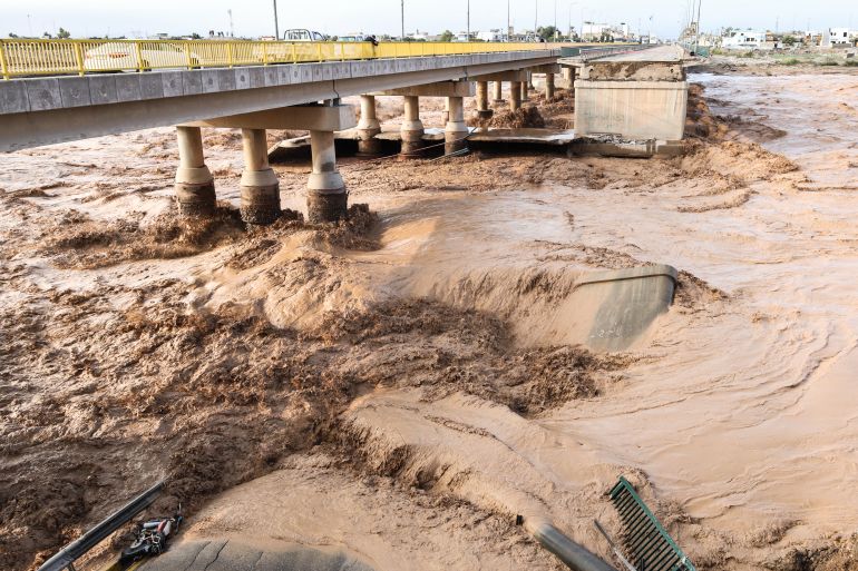 afp_693a948b64a6-1765446795 This photograph shows a collapsed bridge in the Iraqi town of Tuz Khurmatu, on the main road linking Kirkuk to the capital Baghdad, after heavy rains in the country’s northern provinces on December 10, 2025.