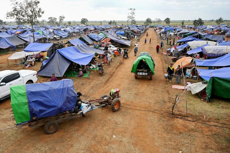 afp_693aa774ecea-1765451636 Displaced people arrive at a temporary camp in Cambodia's Oddar Meanchey province on December 11, 2025, amid clashes along the Cambodia-Thailand border.