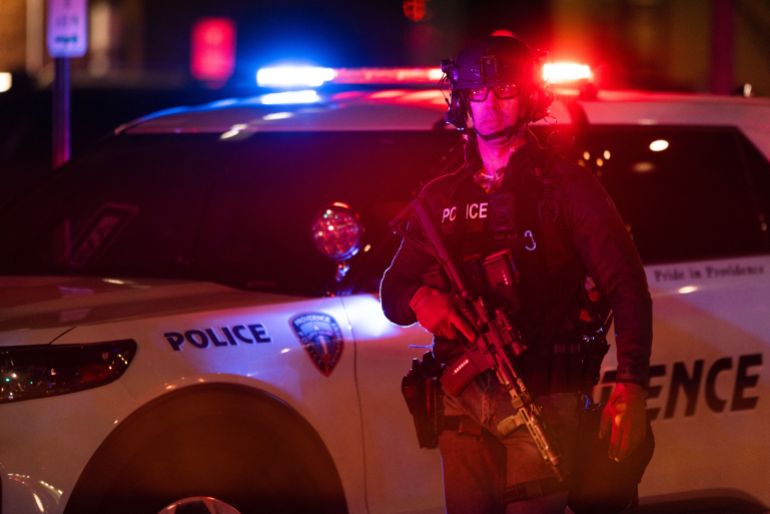 afp_693e5e3bd033-1765695035 PROVIDENCE, RHODE ISLAND - DECEMBER 13: Police officers remain on the scene of a shooting that killed two and wounded at least eight at Brown University on December 13, 2025 in Providence, Rhode Island. Students remain locked in their dorms as police search for the suspect. Libby O'Neill/Getty Images/AFP (Photo by Libby O'Neill / GETTY IMAGES NORTH AMERICA / Getty Images via AFP)