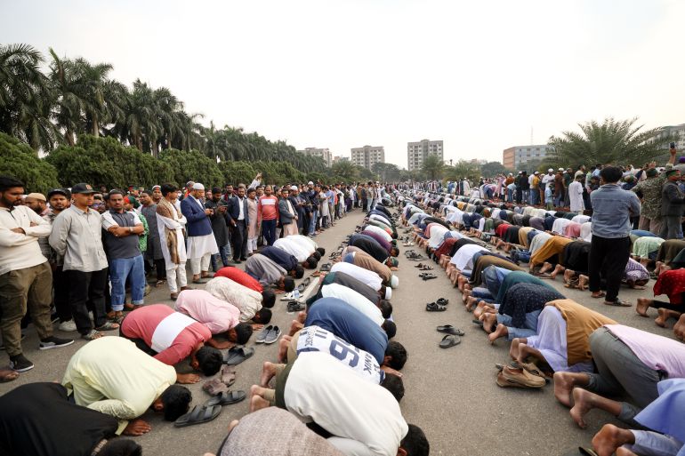 Mourners offer prayers during the funeral of student leader Sharif Osman Hadi in Dhaka on December 20, 2025, after two days of violent protests over his killing.