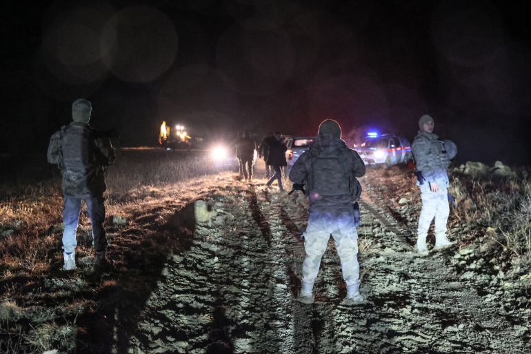 afp_694b280f9c0f-1766533135 Turkish soldiers stand guard at the wreckage site of a Libya-bound business jet as search and rescue operations continue following the crash of a Falcon 50 aircraft carrying Libyan Chief of Staff General Muhammad Ali Ahmed Al-Haddad, found 2 kilometers south of Kesikkavak Village at Haymana district in Ankara on December 23, 2025.