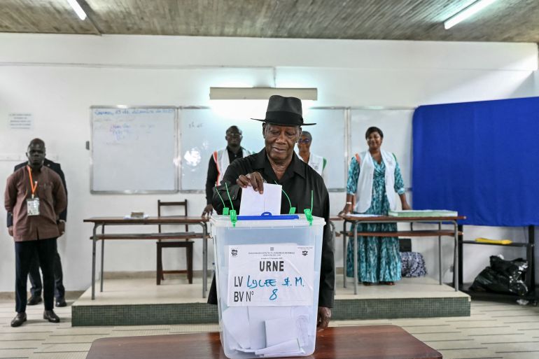 afp_6951f96330bb-1766979939 Ivory Coast's President Alassane Ouattara casts his ballot at a polling station at the Lycee Saint-Marie in Cocody, Abidjan, on December 27, 2025 during Ivory Coast's legislative elections. (Photo by SIA KAMBOU / AFP)