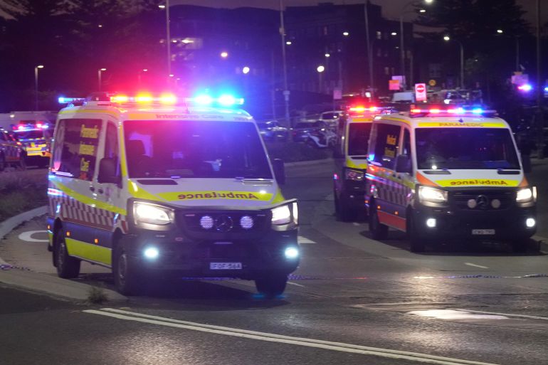 ap25348350959038-1765706275 Ambulances move around at Bondi Beach after a reported shooting in Sydney, Sunday, Dec. 14, 2025. (AP Photo/Mark Baker)