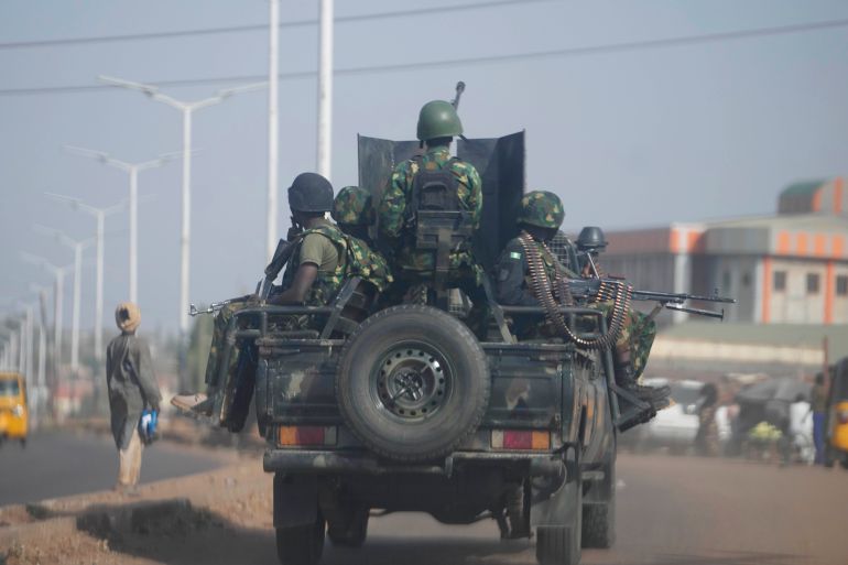 ap_68fa5a6c8be4a-1761237612 FILE - Nigeria army patrols along the Kaduna Birnin Gwari area in Nigeria, March 8, 2024. (AP Photo/Sunday Alamba, File)