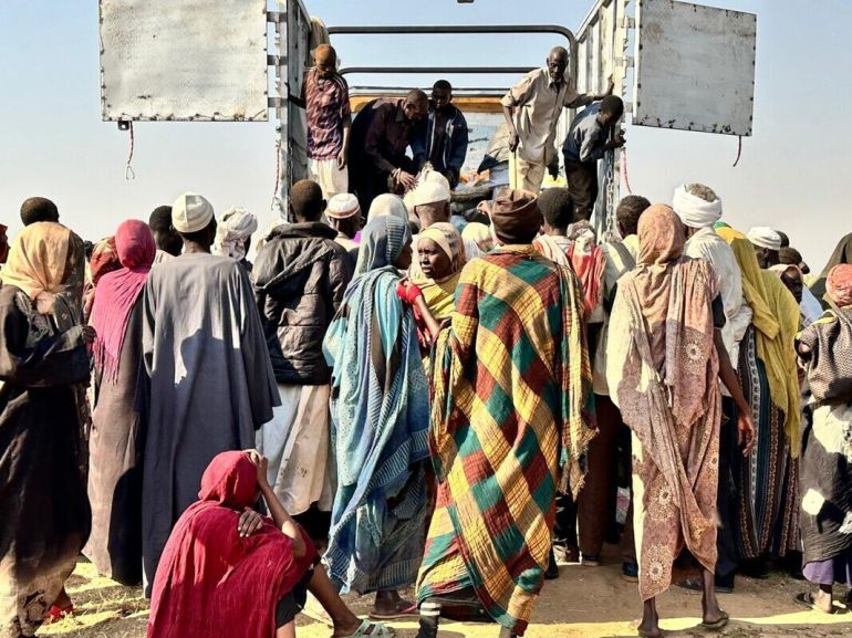 ap_6910c976380e2-1762707830 This photo released by The Norwegian Refugee Council (NRC) shows displaced families from el-Fasher at a displacement camp where they sought refuge from fighting between government forces and the RSF, in Tawila, Darfur region, Sudan, Friday, October. 31, 2025. (NRC via AP)