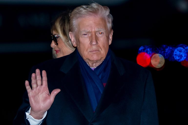 ap_692cebcae6c3c-1764551626 President Donald Trump waves as he and first lady Melania Trump arrive on Air Force One, Sunday, Nov. 30, 2025, at Joint Base Andrews, Md. (AP Photo/Alex Brandon)