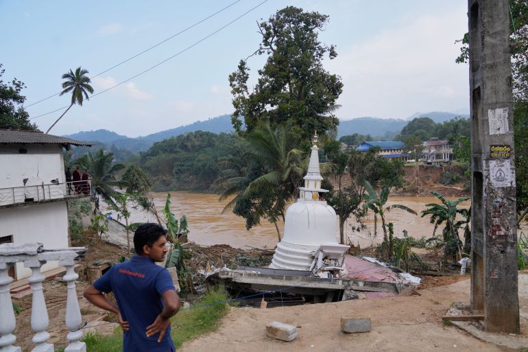 A man looks at the damage caused by the floods at Gampola, Sri Lanka, Monday, Dec.1, 2025. (AP Photo/Eranga Jayawardena)