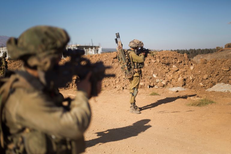 ap_693076f0d1384-1764783856 Israeli soldiers of the Golani brigade take position during training in the Israeli-controlled Golan Heights, on the border with Syria, Tuesday, Sept. 13, 2016. Israel is denying Syrian government claims that its forces shot down a warplane and a drone near the Israeli-controlled part of the Golan Heights. (AP Photo/Ariel Schalit)
