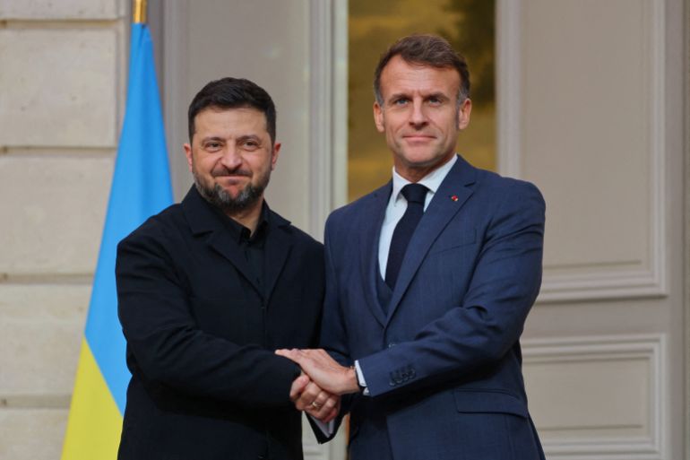 Ukrainian President Volodymyr Zelenskyy, left, and French President Emmanuel Macron shake hands after a joint media conference at the Elysee Palace in Paris, Monday, Nov. 17, 2025. (Sarah Meyssonnier, Pool Photo via AP)