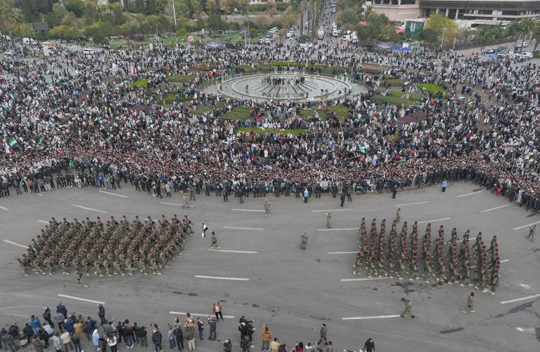 New Syrian army march during a parade marking the first anniversary of the ousting of former President Bashar Assad in Damascus, Syria, Monday, Dec. 8, 2025. (AP Photo/Hussein Malla)