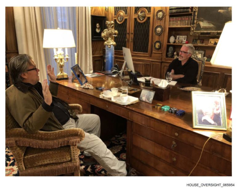 This undated photo released by Democrats on the House Oversight Committee Thursday, Dec. 18, 2025, shows Jeffrey Epstein talking with Steve Bannon. (House Oversight Committee via AP)