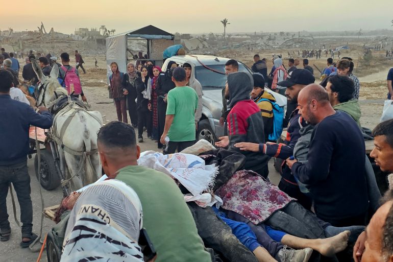 d8aed986d987-2-1748760324 EDITORS NOTE: Graphic content / Displaced Palestinians push a cart with bodies after people were reportedly hit by Israeli fire near a food distribution centre in Rafah in the southern Gaza Strip on June 1, 2025. Gaza rescuers said Israeli gunfire killed at least 10 Palestinians and wounded more than 100 early on June 1, as thousands of people headed towards a US-backed aid distribution site. (Photo by AFP)