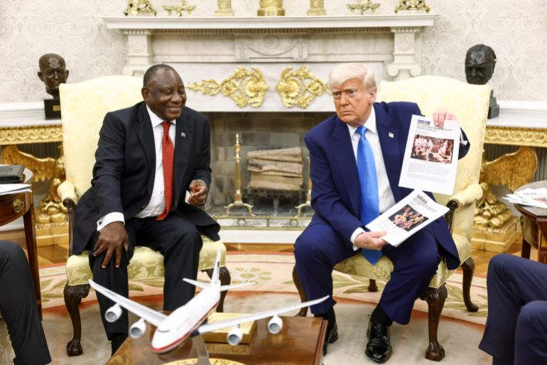 epa_682e154b4c88-1747850571 epa12123467 US President Donald Trump (R) holds up news articles related to violence in South Africa during a meeting with South Africa’s President Cyril Ramaphosa (L), in the Oval Office of the White House in Washington, DC, USA, 21 May 2025. Ramaphosa’s visit comes one week after Trump claimed there is an on-going genocide in South Africa and granted refugee status to 59 Afrikaners. EPA-EFE/JIM LO SCALZO