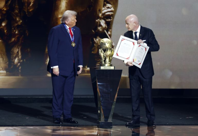 epa_693333974abf-1764963223 epa12572676 US President Donald Trump (L) receives the FIFA Peace Prize from FIFA President Giovanni Infantino during the FIFA World Cup 2026 Final Draw at the Kennedy Center in Washington DC, USA, 05 December 2025. EPA/WILL OLIVER