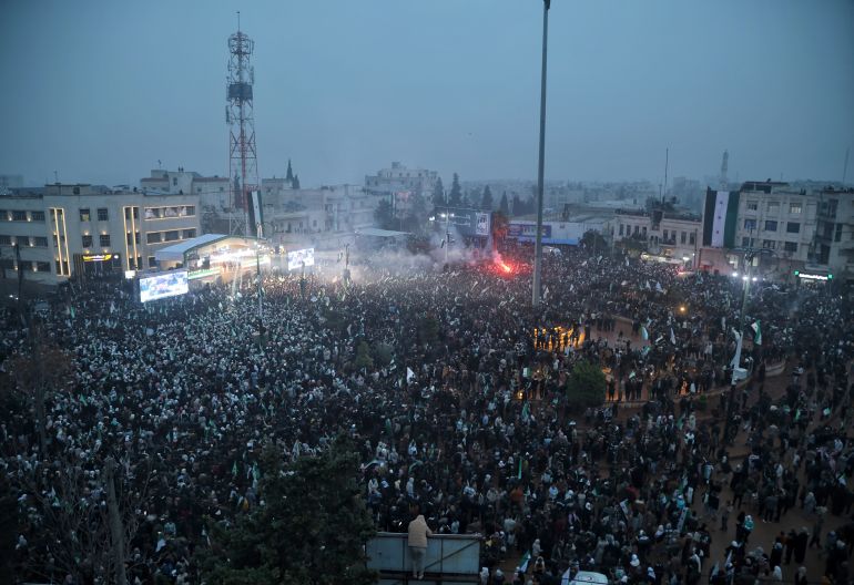epa_6937e16b4df6-1765269867 epa12579208 People gather during a parade marking the first anniversary of the ousting of the Bashar al-Assad regime in Idlib, Syria, 08 December 2025. Syria marks the first anniversary of the overthrow of the Assad regime on 08 December when the dictatorship of Bashar al-Assad collapsed during a major offensive by opposition forces. EPA/BILAL AL-HAMMOUD