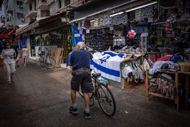 f250623ys21-1200x802-1765997287 People walk through Tel Aviv’s Carmel Market, partially closed following ongoing missile attacks from Iran, June 23, 2025