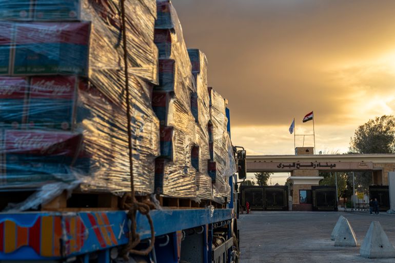 getty_68fc7d5740-1761377623 RAFAH, EGYPT - OCTOBER 12: Truck carrying aid enter Gaza through the border crossing on October 12, 2025 in Rafah, Egypt. This week's ceasefire deal between Israel and Hamas has brought an end to the two years of war that followed the attacks of Oct. 7, 2023, allowing aid groups to increase delivery of humanitarian relief. (Photo by Ali Moustafa/Getty Images)