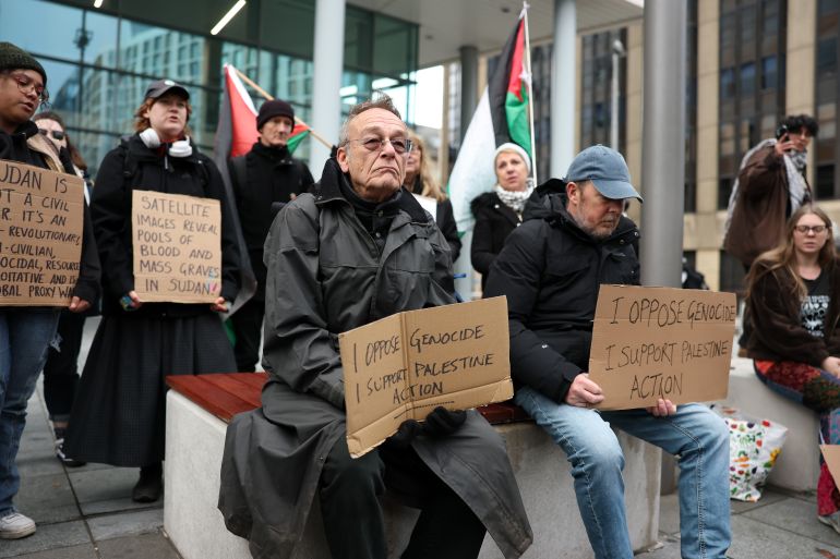 getty_693294d7d1-1764922583 CARDIFF, WALES - NOVEMBER 29: Protesters hold signs reading "I oppose Genocide, I support Palestine Action" outside the stadium prior to the Quilter Nations Series 2025 rugby international match between Wales and South Africa at Principality Stadium on November 29, 2025 in Cardiff, Wales. (Photo by Dan Mullan/Getty Images)