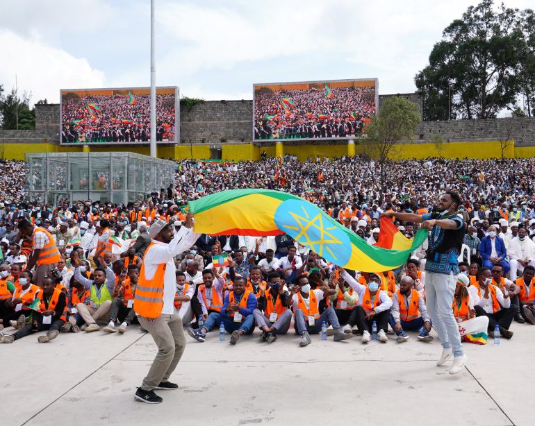 getty_693bec68e3-1765534824 ADDIS ABABA, ETHIOPIA - OCTOBER 04: Jubilant crowds wave flags and chant during an inaugural event acknowledging Abiy Ahmed being sworn in as Prime Minister on October 04, 2021 in Addis Ababa, Ethiopia. Mr Abiy's Prosperity Party was able to claim a majority after June's initial round of voting, although the country's election board postponed the vote in several dozen constituencies citing security and logistical concerns. Polls for dozens of those seats were held at the end of September, but there is no timeline for voting in several dozen remaining constituencies. (Photo by Jemal Countess/Getty Images)