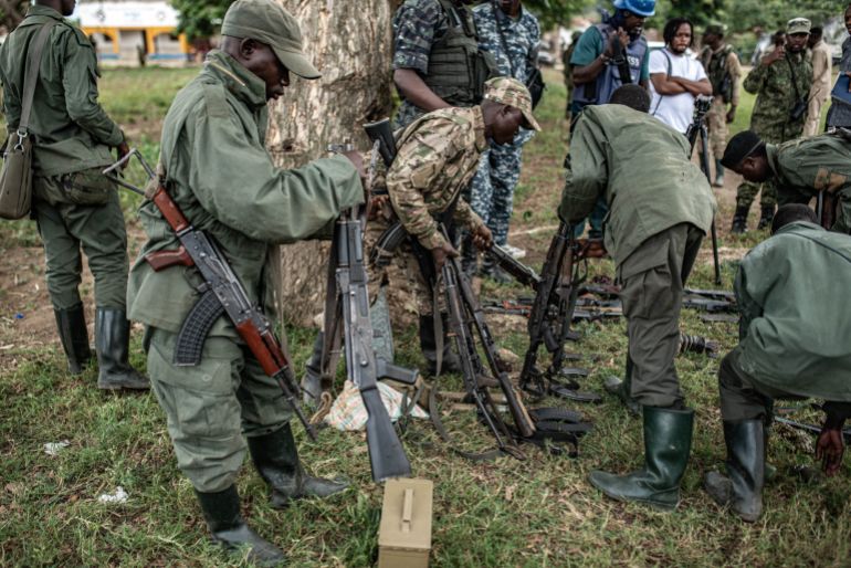 getty_69411bbfa0-1765874623 UVIRA, DEMOCRATIC REPUBLIC OF CONGO - DECEMBER 15: Members of the Rwanda-backed M23 rebel group inspect weapons surrender by Wazalendo militants on December 15, 2025 in Uvira, Democratic Republic of Congo. Fifty-two members from the coalition of Congolese and Burundian militias known as the Wazalendo joined M23 following the rebels' capture of the South Kivu city on December 10. Human Rights Watch has reported abuses perpetrated against civilians by fighters from both sides of the conflict during the offensive on Uvira, and has called for the safe passage and humanitarian assistance for those caught up in the fighting. (Photo by Daniel Buuma/Getty Images)