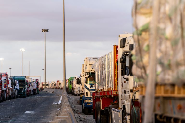 RAFAH, EGYPT - OCTOBER 12: Trucks carrying aid wait at the border crossing for entry into the Gaza Strip on October 12, 2025 in Rafah, Egypt. This week's ceasefire deal between Israel and Hamas has brought an end to the two years of war that followed the attacks of Oct. 7, 2023, allowing aid groups to increase delivery of humanitarian relief. (Photo by Ali Moustafa/Getty Images)