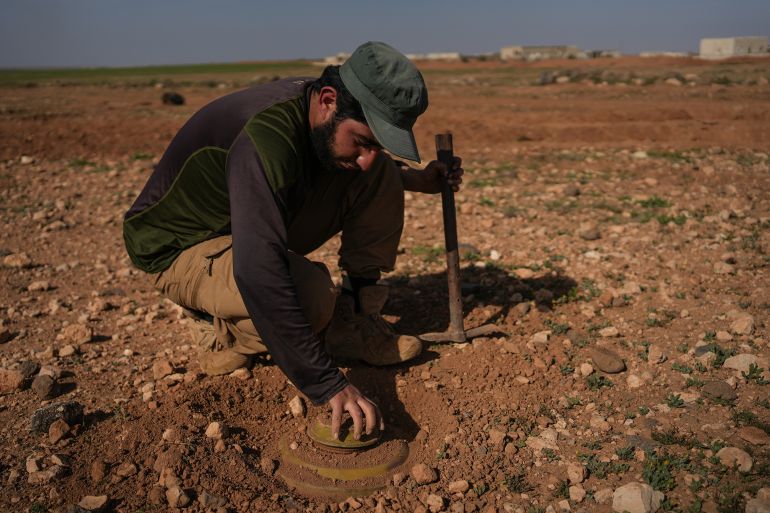 gettyimages-2206566217-1744149759 25 March 2025, Syria, Umm Rajim: A military engineering team works to clear and detonate minefields in the village of Umm Rajim in the eastern Idlib countryside. The 103rd Division of the New Syrian Army continues efforts to dismantle mines planted by Bashar al-Assad's forces on former battlefronts in the Idlib, Aleppo, and Hama countrysides. These mines have killed more than 200 people in the first three months after the fall of the Assad regime. The teams, working with primitive equipment, face slow and dangerous conditions, having already lost several members in the process. Photo: Moawia Atrash/dpa (Photo by Moawia Atrash/picture alliance via Getty Images)