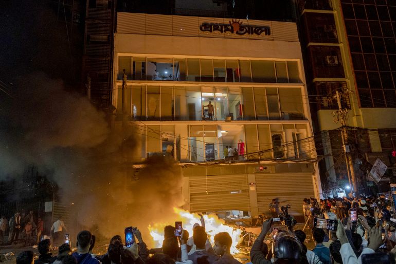 gettyimages-2251928128-1766151125 DHAKA, BANGLADESH - DECEMBER 18: Supporters of Sharif Osman Hadi blocked streets and set fires in Dhaka after news of his death on December 18, 2025, at a Singapore hospital in Bangladesh on December 18, 2025. Hadi had been critically injured by a gunshot to the head on Dec. 12 while participating in a political rally in Bijoynagar. He was initially treated at Dhaka Medical College Hospital, underwent surgery, and later flown to Singapore for advanced care.Demonstrators targeted media outlets including The Daily Star and Prothom Alo, causing property damage and setting fires during the protests. (Photo by Abdul Goni/Anadolu via Getty Images)