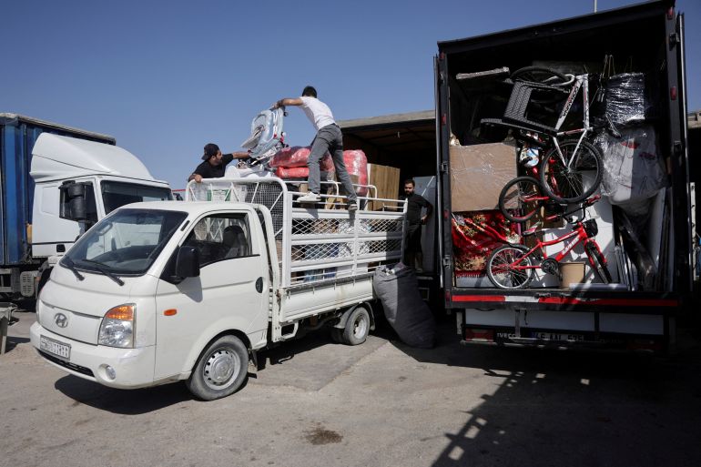 pic-5545-1765555988 Syrian returnee Ahmed Al-hadid, and his family members load belongings onto a truck, in Aleppo's countryside, Syria May 28, 2025. REUTERS/Khalil Ashawi
