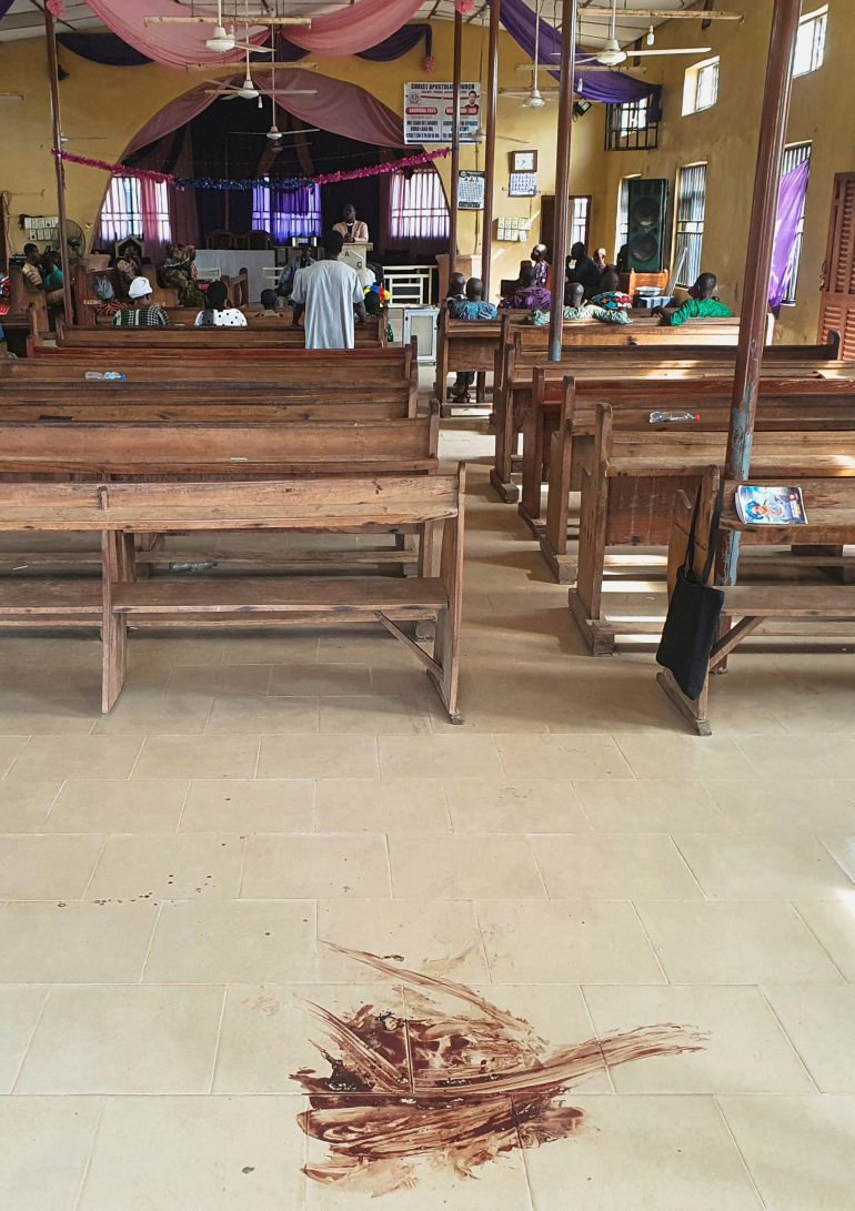 reuters_69235e8c-1763925644 Bloodstains cover the floor of the Christ Apostolic Church during a Sunday service held for those killed and kidnapped in an attack by gunmen on November 18, in the town of Eruku, Kwara state, Nigeria, November 23, 2025. REUTERS/Abdullahi Dare Akogun