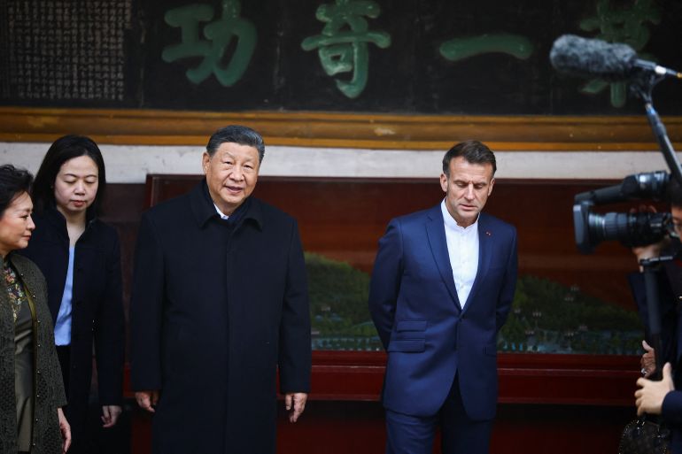 reuters_69327c8c-1764916364 French President Emmanuel Macron and Chinese President Xi Jinping visit the Dujiangyan site, designated a UNESCO World Heritage Site, in Dujiangyan, Sichuan province, as part of Macron's three-day visit to China, December 5, 2025. REUTERS/Sarah Meyssonnier/Pool