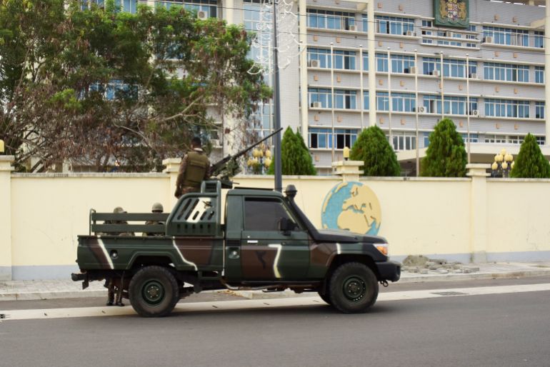 reuters_69372c38-1765223480-1 A military armoured vehicle takes position in front of the headquarters of Benin's radio and television station a day after the country's armed forces thwarted the attempted coup against the government of Benin's President Patrice Talon, in Cotonou, Benin, December 8, 2025. REUTERS/Charles Placide Tossou