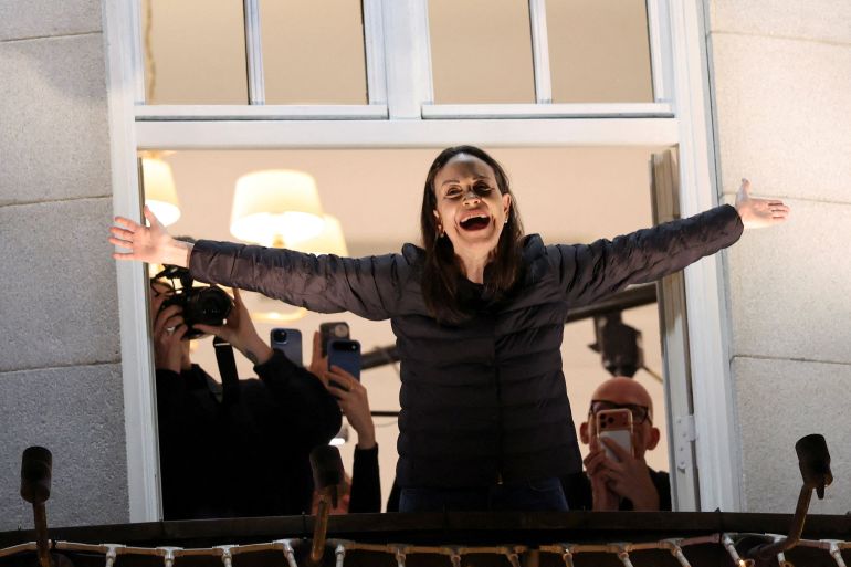 reuters_693ae4cd-1765467341 Nobel Peace Prize laureate Maria Corina Machado reacts from a balcony of Grand Hotel, after her daughter Ana Corina Sosa Machado, accepted the award on her behalf, in Oslo, Norway December 11, 2025. REUTERS/Leonhard Foeger TPX IMAGES OF THE DAY