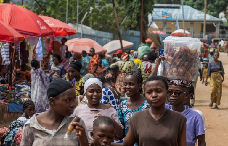 reuters_69411a43-1765874243 Congolese civilians walk at Maendeleo market as calm returns after clashes between members of the Alliance Fleuve Congo (AFC) and the M23 Movement, who took control of Uvira from the Armed Forces of the Democratic Republic of the Congo (FARDC), in Uvira on the shores of Lake Tanganyika, South Kivu province, Democratic Republic of the Congo, December 15, 2025. REUTERS/Stringer